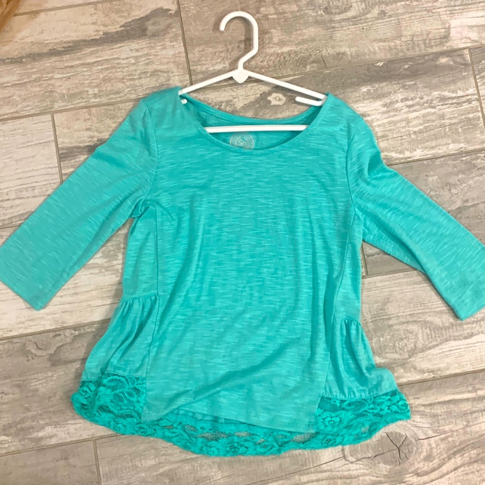 Aqua long sleeved shirt with lace at the bottom